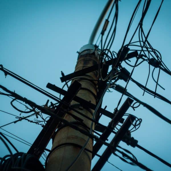 low angle photography of utility tower