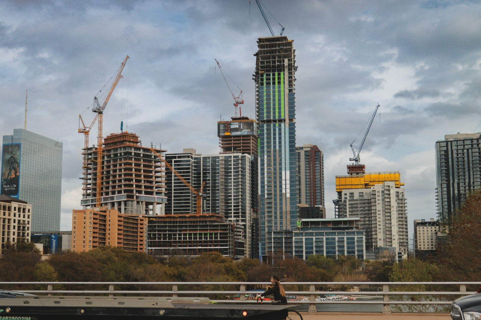 City skyline with buildings under construction.