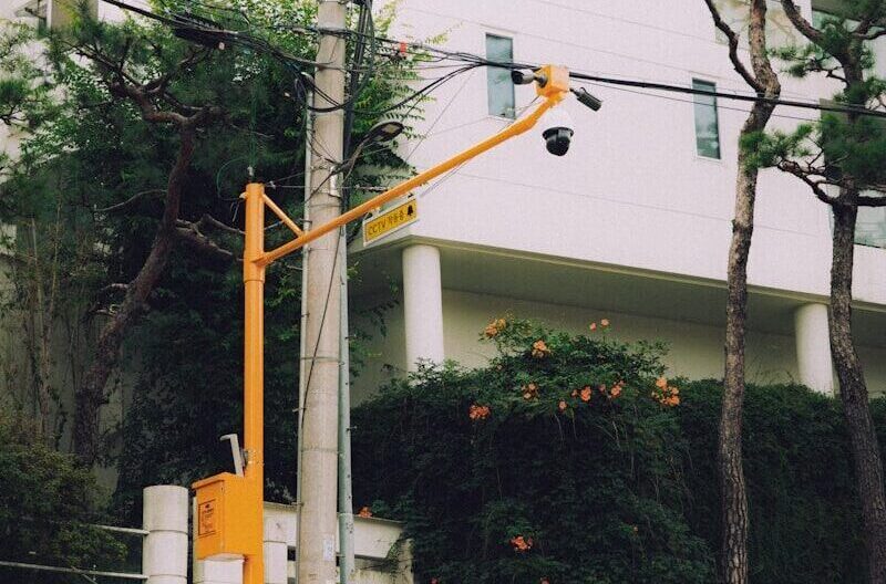 Street pole with cameras and traffic cones