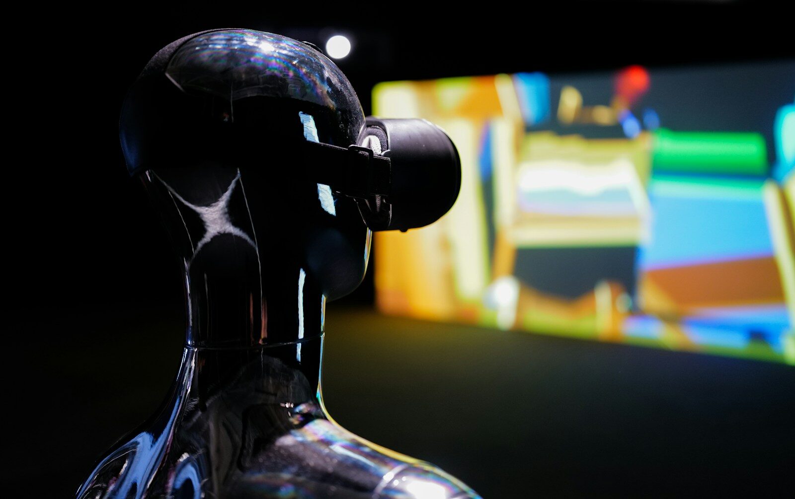 a close up of a robot looking at a screen