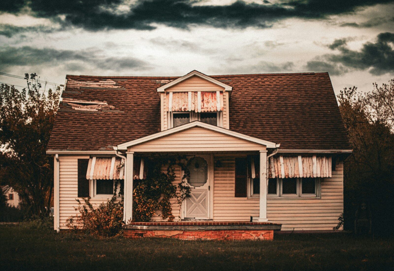 Old abandoned house under a stormy sky